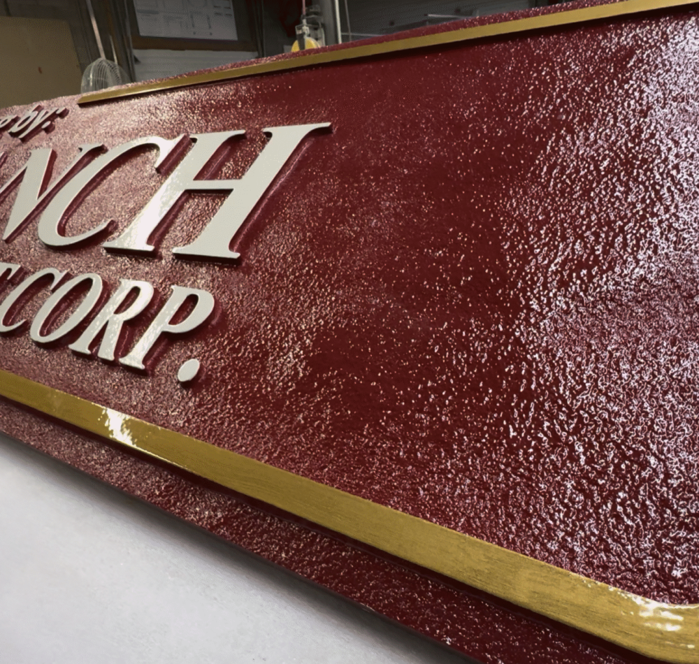 Dimensional Sandblasted with raised copy and lettering by Hanson Signs Wholesale Sign Manufacturer